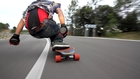 Longboard Rider Cruises and Makes Sparks With His Hands