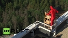 Russia: Norwegian daredevil handstands on edge of building