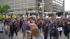 Mayday protesters march on Baltimore City Hall and Jail past riot cops and armored vehicles
