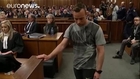 Pistorius removes prosthetic legs in court