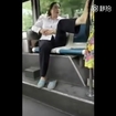 Woman opens crotch with leg high in air on bus
