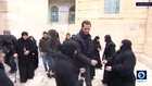 Assad makes Christmas visit to orphaned children