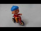 BIG HEAD KID ON TRICYCLE CELLULOID WIND UP TIN TOY JAPAN