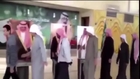 STUPID muslims queue up to SHAKE HANDS with CARDBOARD CUTOUTS of the King of Saudi Arabia