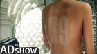 Naked woman tries unusual tattoo